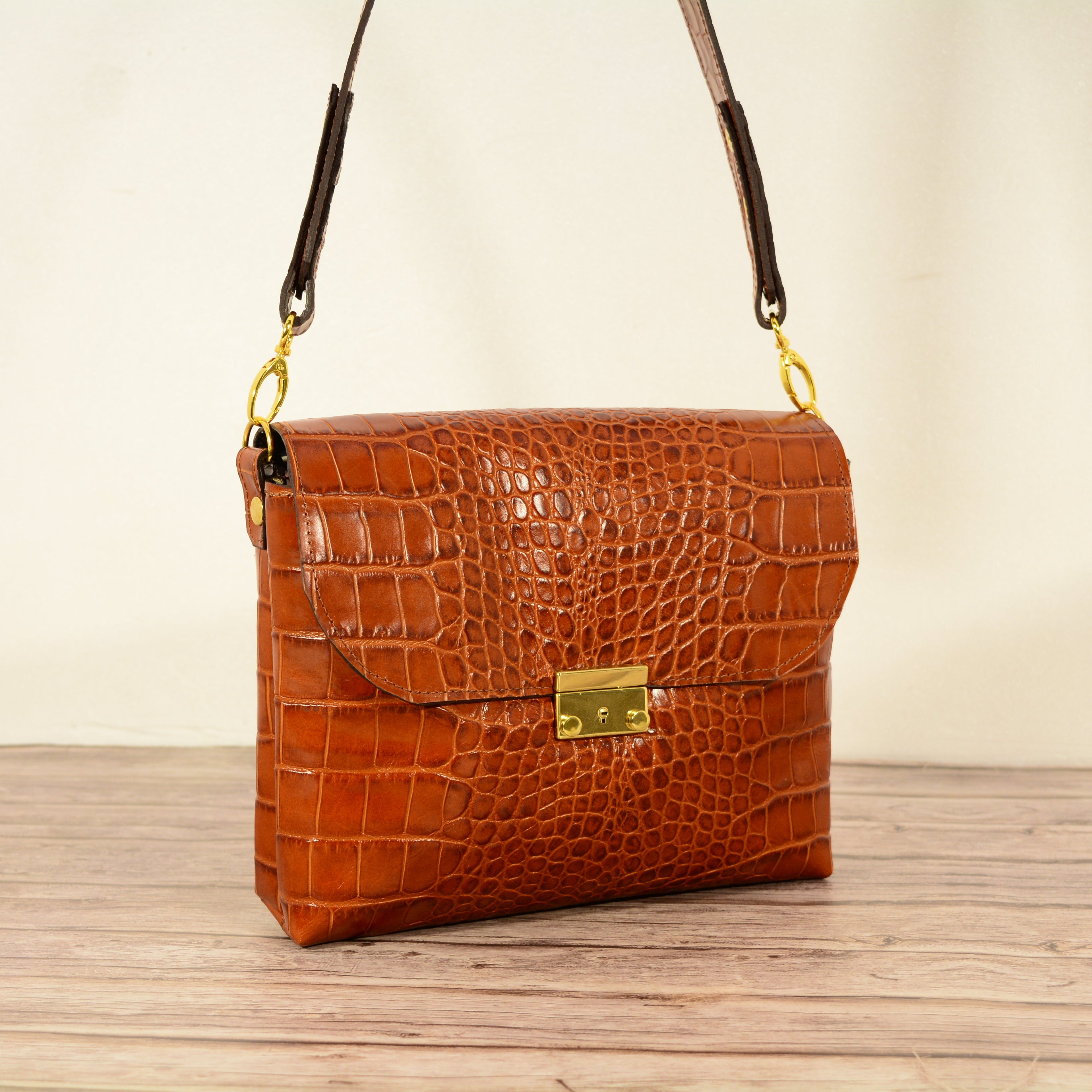 Cognac croc-print leather shoulder bag studio shot