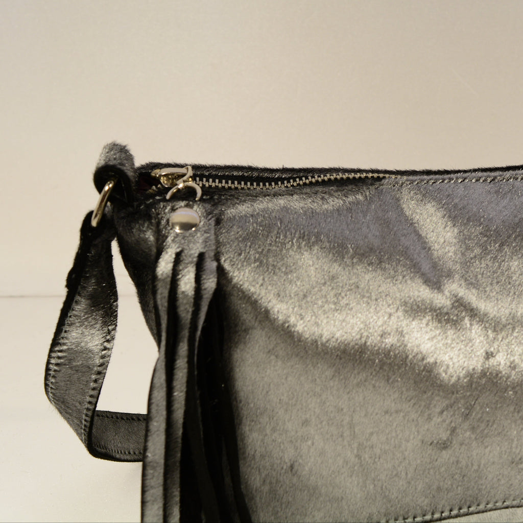 Silver grey genuine fur crossbody bag close-up showing metallic texture and zipper