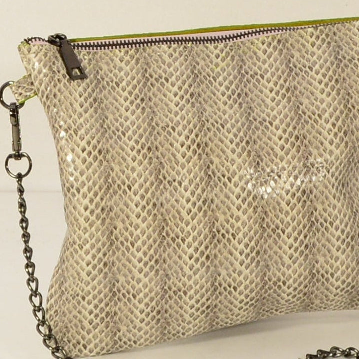 Snake print leather crossbody bag full studio shot on white background